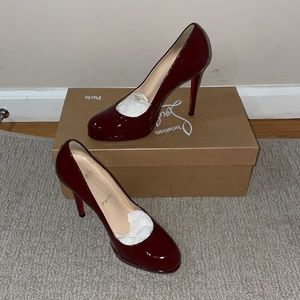 Christian Louboutin burgundy pumps